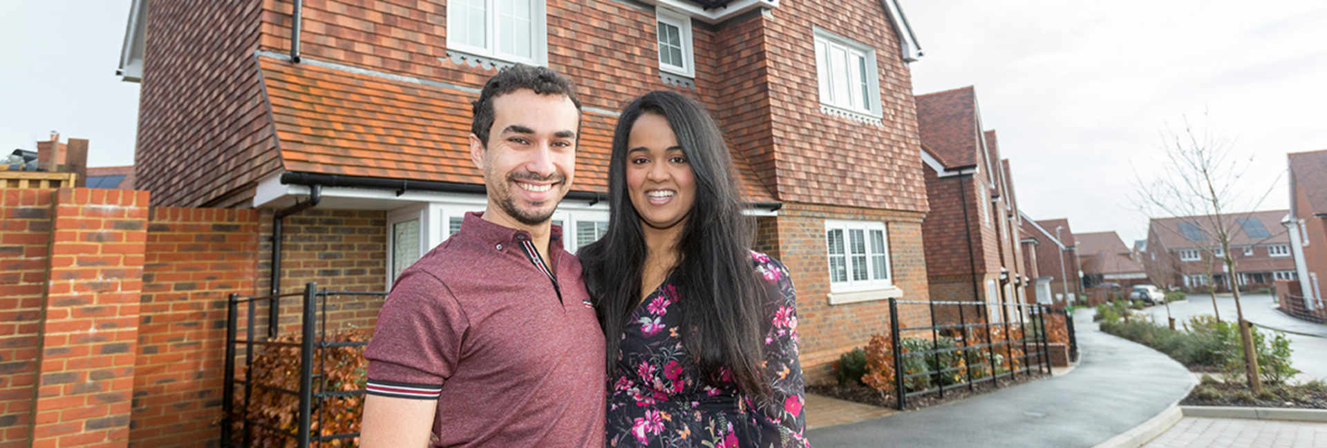 Tania and Pantelis standing together outside their Hollyfields home in Tunbridge Wells.