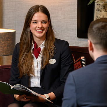 A sales graduate talking to a customer