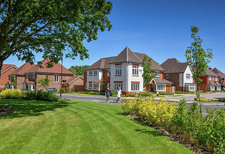 External picture of several Highwood Village homes with garden in the foreground