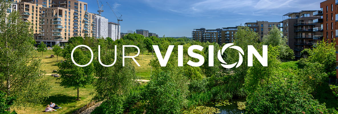 An exterior image of a development with the Our Vision logo on the top