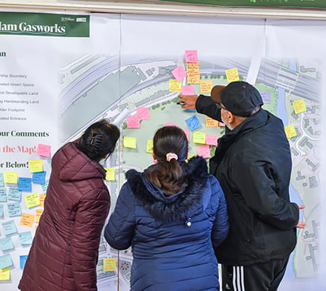 An image of people looking at a green space map