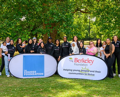 An image of people behind some signs for Berkeley Foundation and The change Foundation
