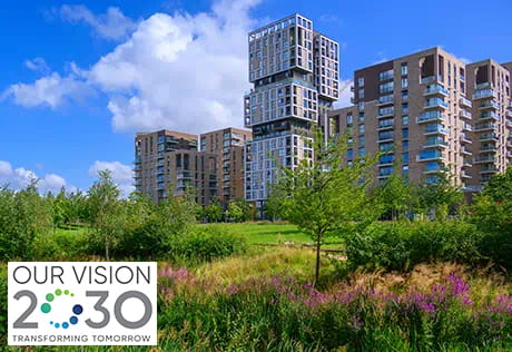 An exterior image of Kidbrooke Village with the Our Vision 2030 logo