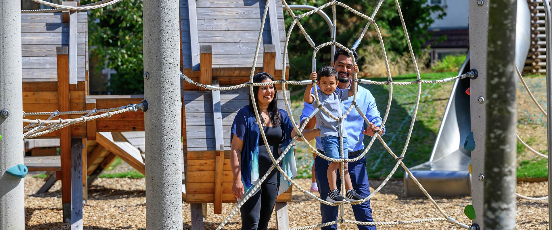An Image of Family Playing in Playground