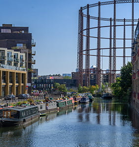 An image of the canal at Bethnal Green with the old gasworks in the background