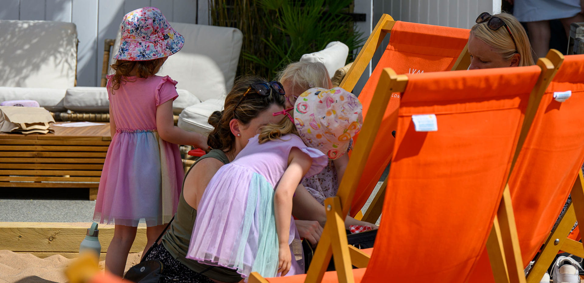 An image of children with their family at The Beach Club