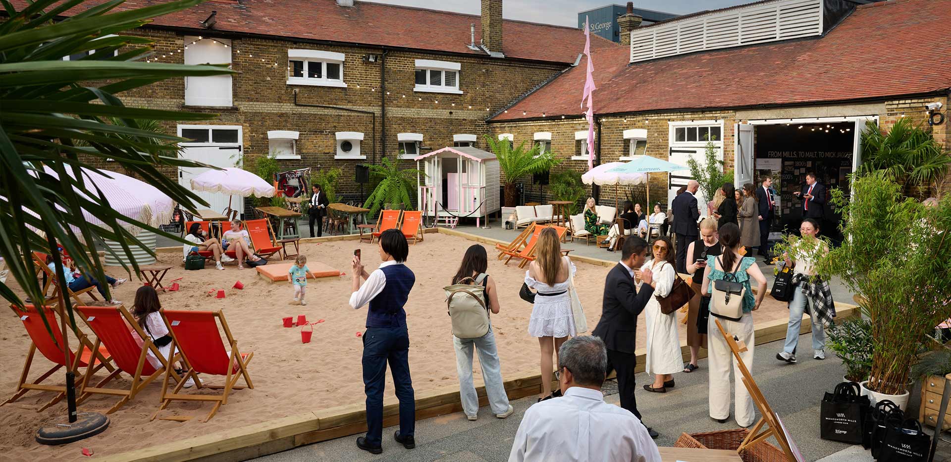 An image of people standing around at The Beach club