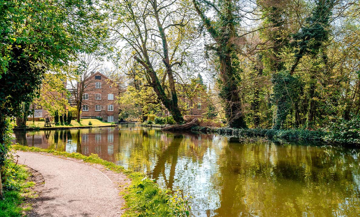 A landscape view of a river at Cassiobury Park in Hertfordshire.