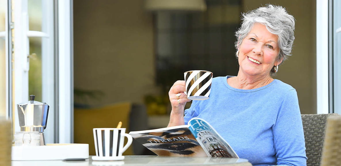 Judie Snow on the terrace of her Holborough Lakes apartment