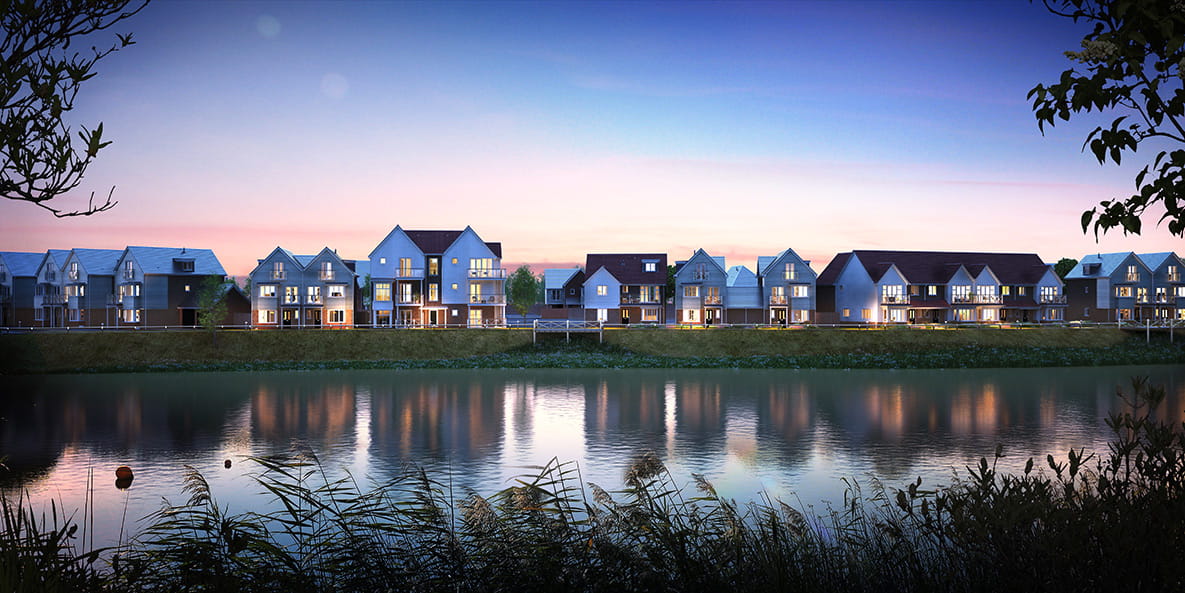 A landscape view of the homes at Holborough Lakes, in front of the water.