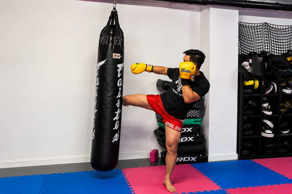 Kenny photographed practicing Muay Thai techniques