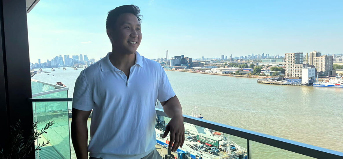 Kenny photographed on his balcony overlooking the city