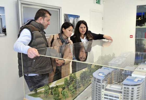 A couple looking at a new development model