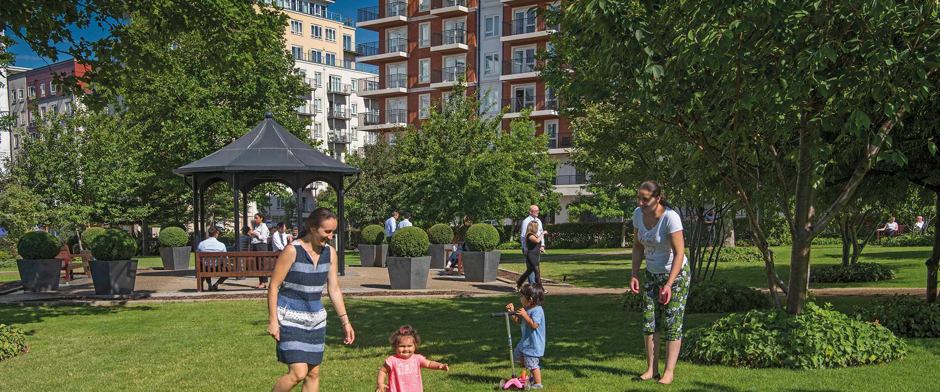 An image of people playing on green space