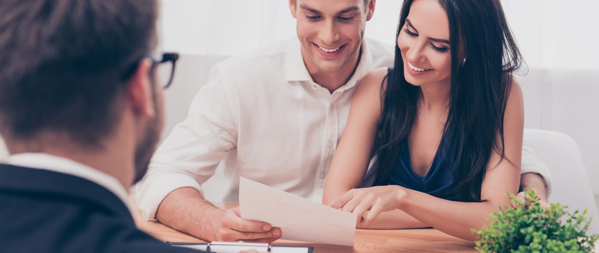 First time buyers reading a mortgage agreement