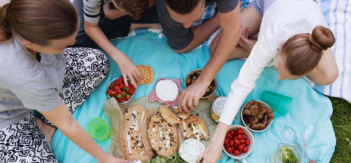 An image of a family enjoying a delicious picnic