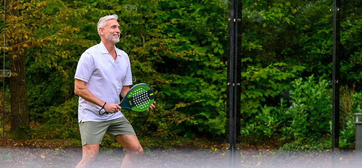 An image of a man enjoying playing padel