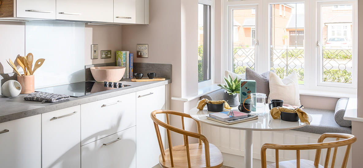 Interior image of kitchen with bright light shining through kitchen windows