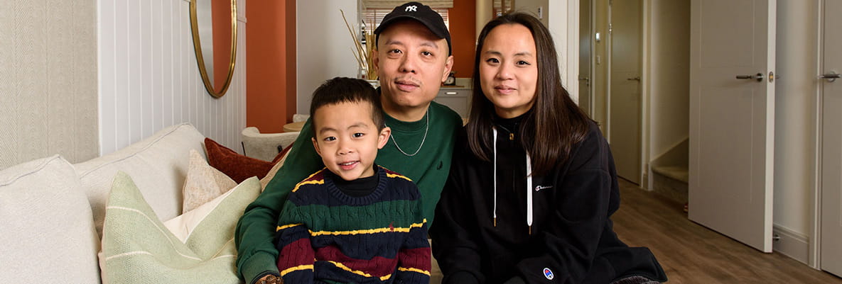 An image of Debbie and Eric with their son at their new home at Hartland Village