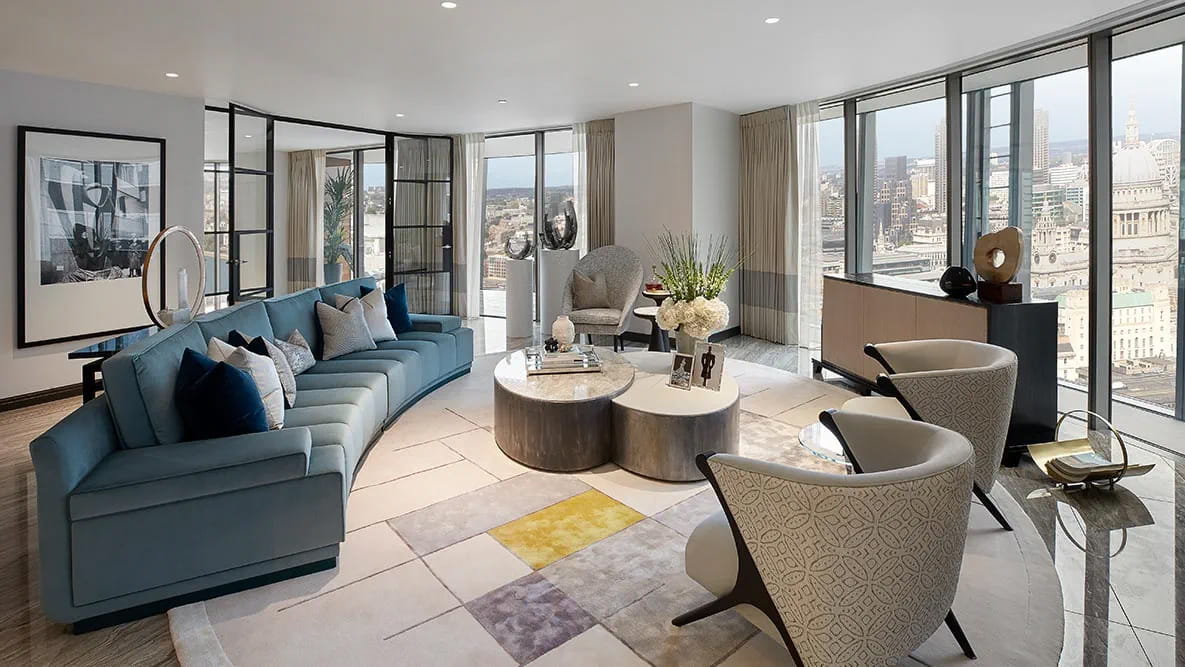 The living area of a large, modern apartment with views of London.