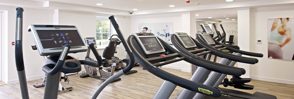 An assortment of treadmills and cross trainers at the Ryewood residents' gym.
