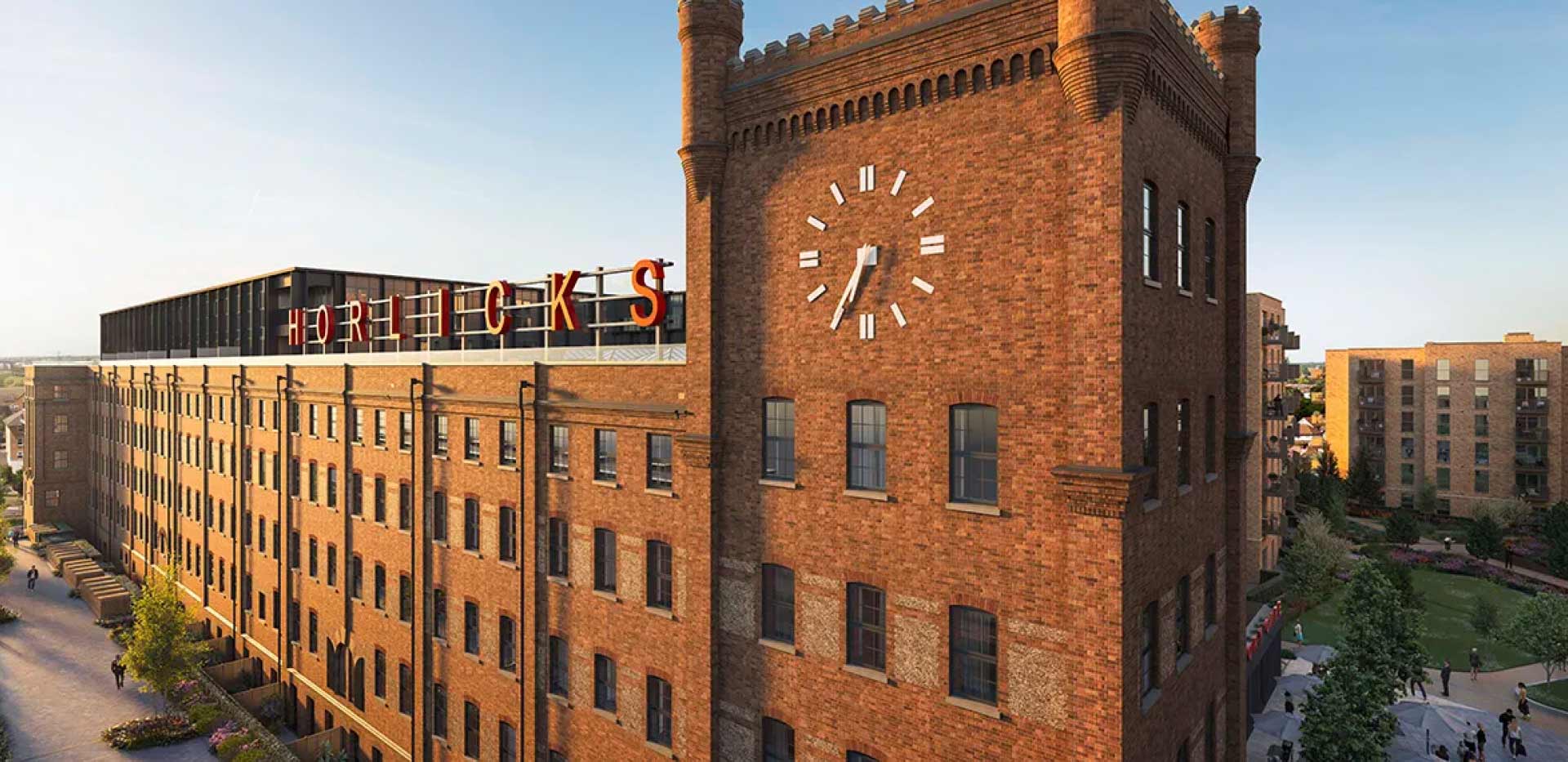 The Horlicks Factory in Horlicks Quarter, Slough—a development by Berkeley Group—features a large ‘HORLICKS’ sign and a crenellated Clock Tower.