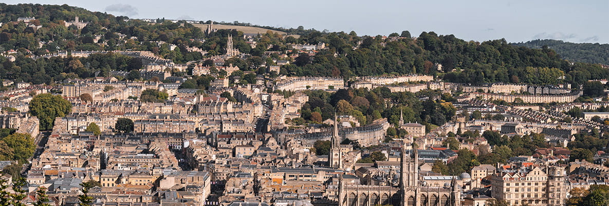 Oblique view of the city of Bath, its green surroundings and hillside landscape.