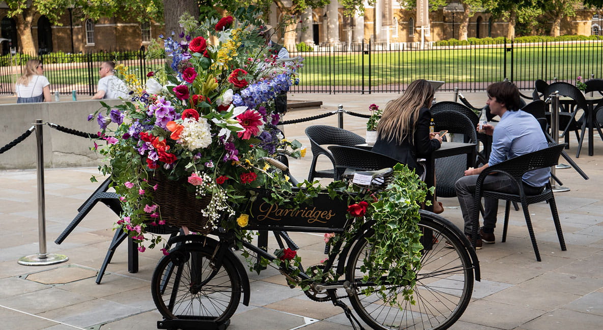 Bike decorated with various bright coloured flowers