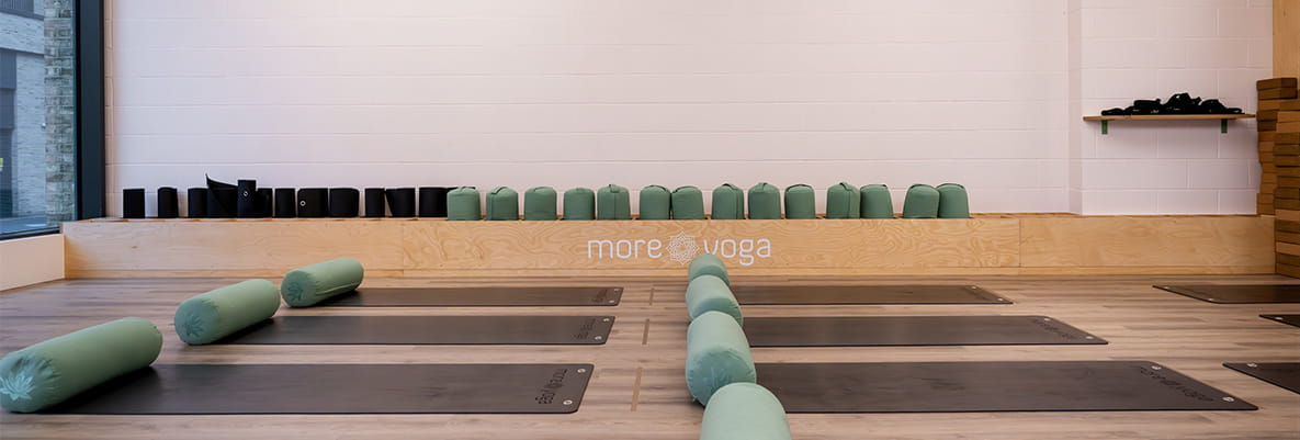 Yoga mats laid out in a studio.