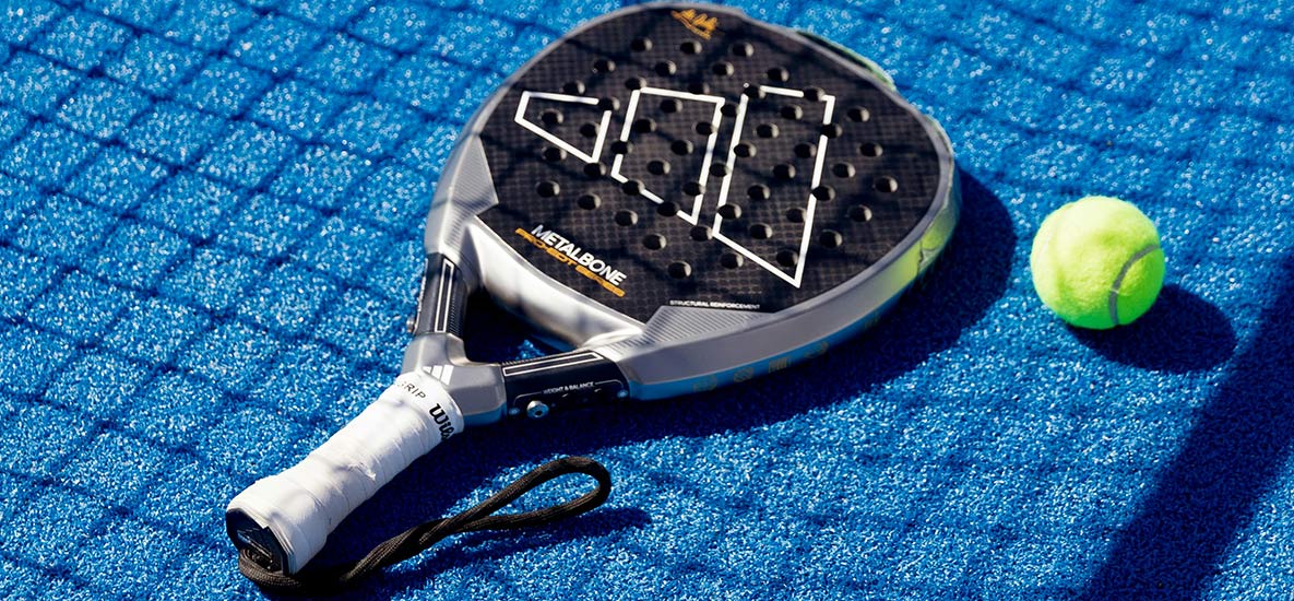 Padel court, racket and ball