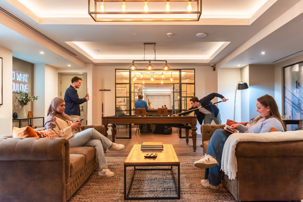 Lounge area with seating and pool table.