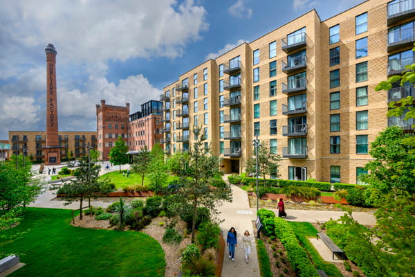 Horlicks Factory in background, new build apartment blocks and green recreation space in foreground.