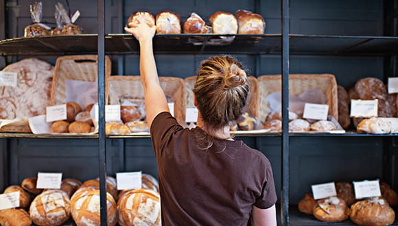 Picture of person stocking a bakery 
