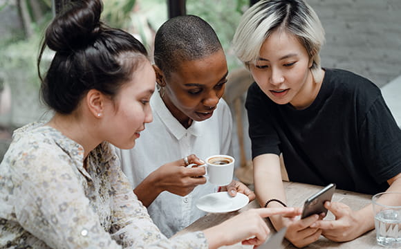 Picture of people socialising at a cafe