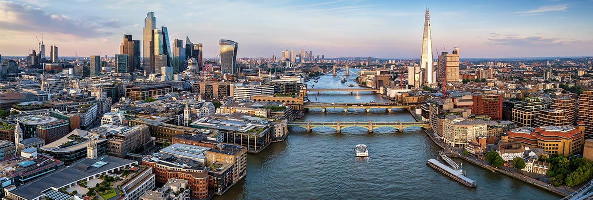 An aerial photograph of london showing the skyline and the river thames