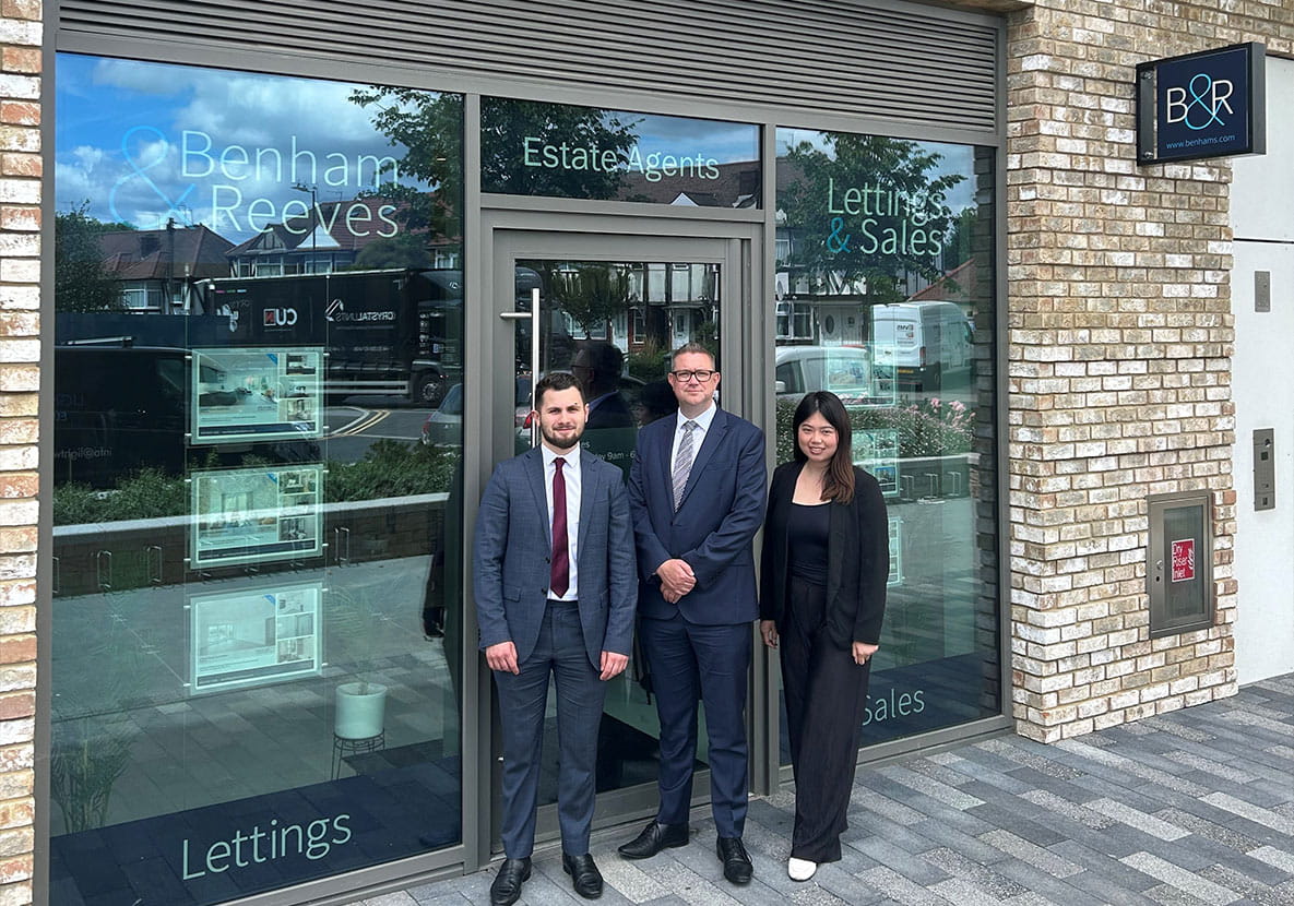 Image of People for Benham and Reeves standing outside