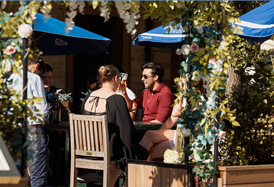 An image of people sat at a cafe