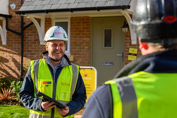 An image of builders during the construction phase of a new development