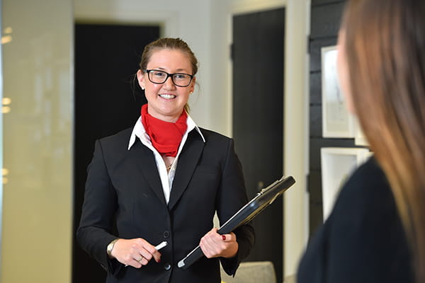 An image of a Sales Team member meeting with customers