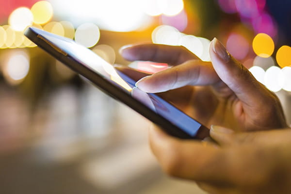 An image of someone using their mobile phone device