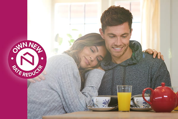 An image of a young couple eating breakfast