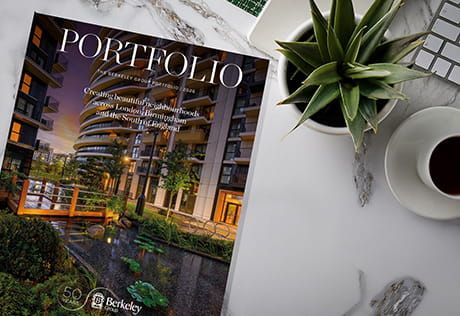 An image of the Berkeley Group Portfolio on a marble desk top surface with coffee and a plant