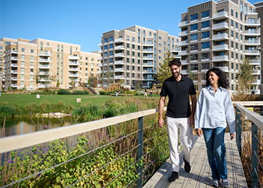 An image of a couple walking at Lombard Square