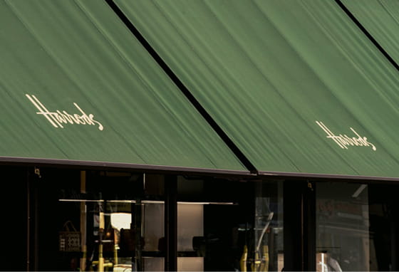 Harrods storefront with its signature green awning