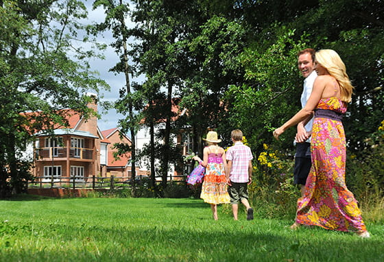 Residents walking on grass in Edenbrook Village, Fleet.