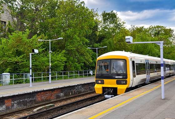 An exterior photograph of a train pulling into the train station