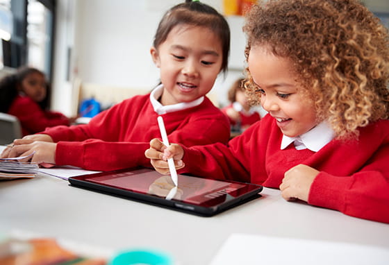 School children using a tablet