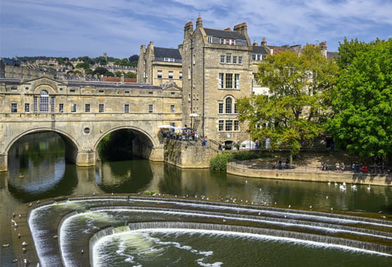 River Avon with a stone bridge in Bath, Somerset.
