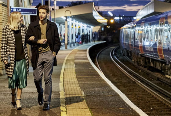 Train station in Surrey with a platform and commuter train