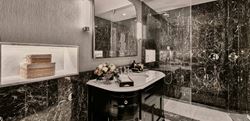 Dark marble themed shower room